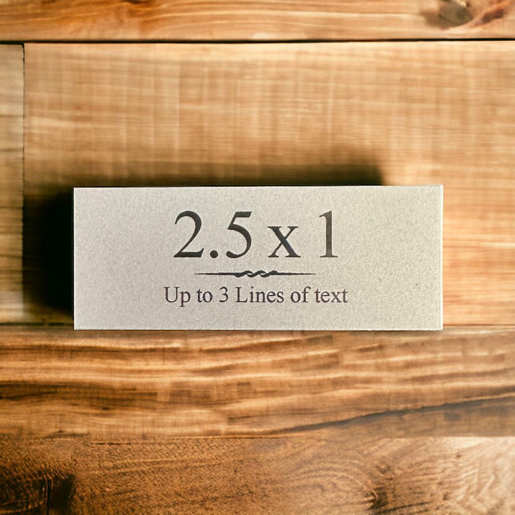 silver and black plate on hardwood