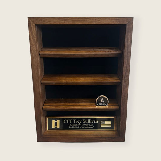 coin display case with glass removed. Space force military coin and black and gold engraved plate displayed inside