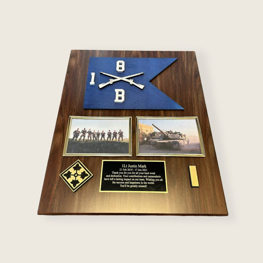 walnut finish guidon plaque with a painted wood guidon, 2 6x4 photo frames,2 wood coins, and an engraved plate in black and gold color scheme