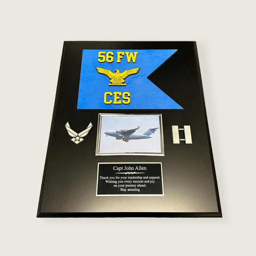 guidon plaque in black finish with a painted wood guidon, wood coins, 6x4 photo frame and an engraved plate in black and silver color scheme