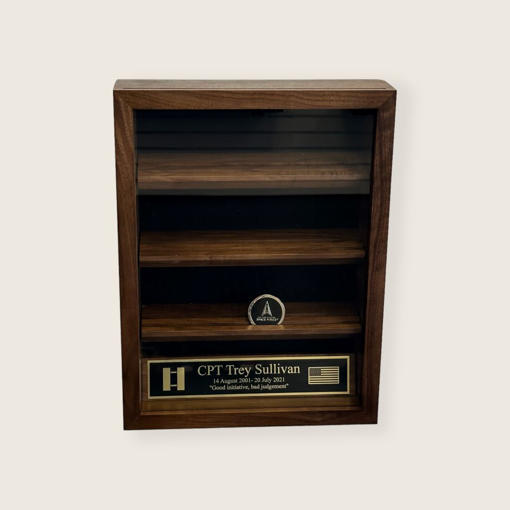 Coin display case with glass front. Space force military coin and black and gold engraved plate displayed inside